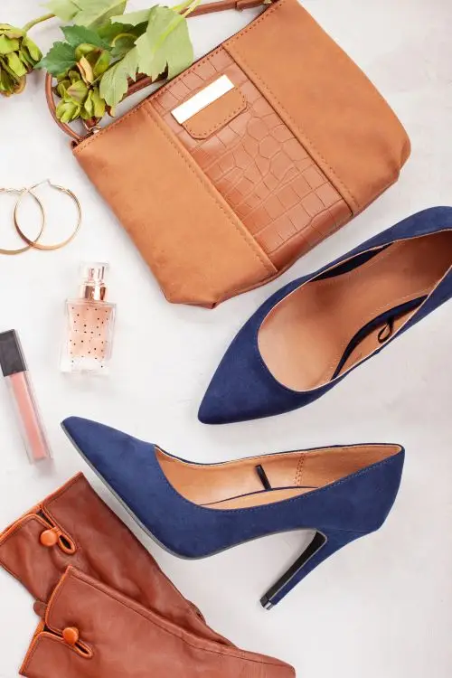 Luxury blue high heels and matching accessories for a stylish look.