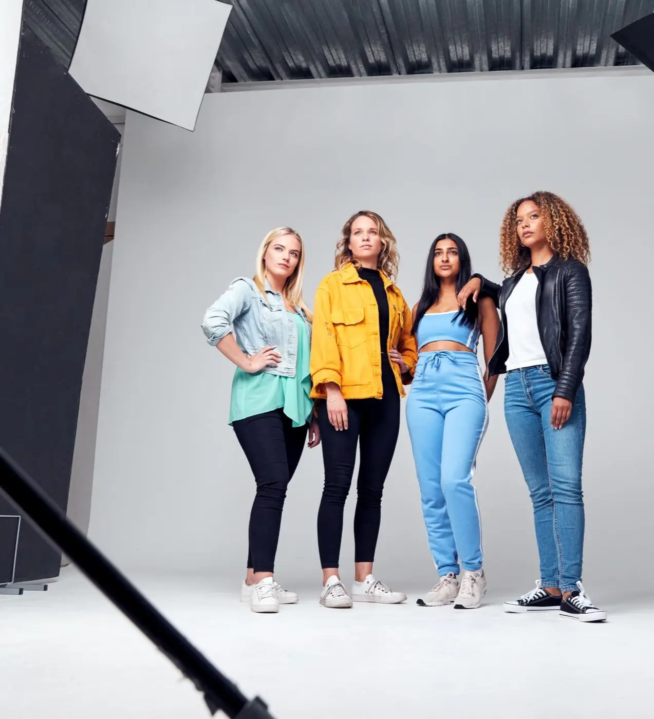 Studio shot of young independent multi-cultural professionals.