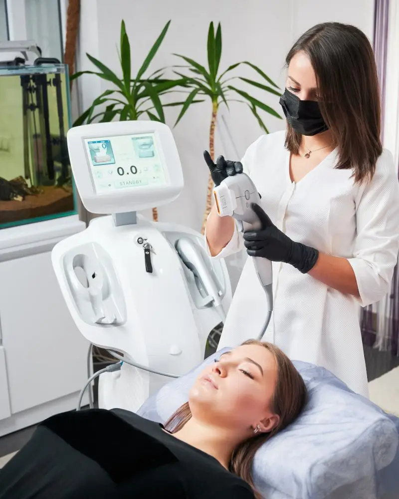 Beauty professional preparing for a skincare procedure for her client.